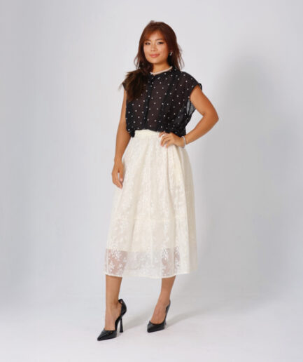 Black polka-dot sleeveless top